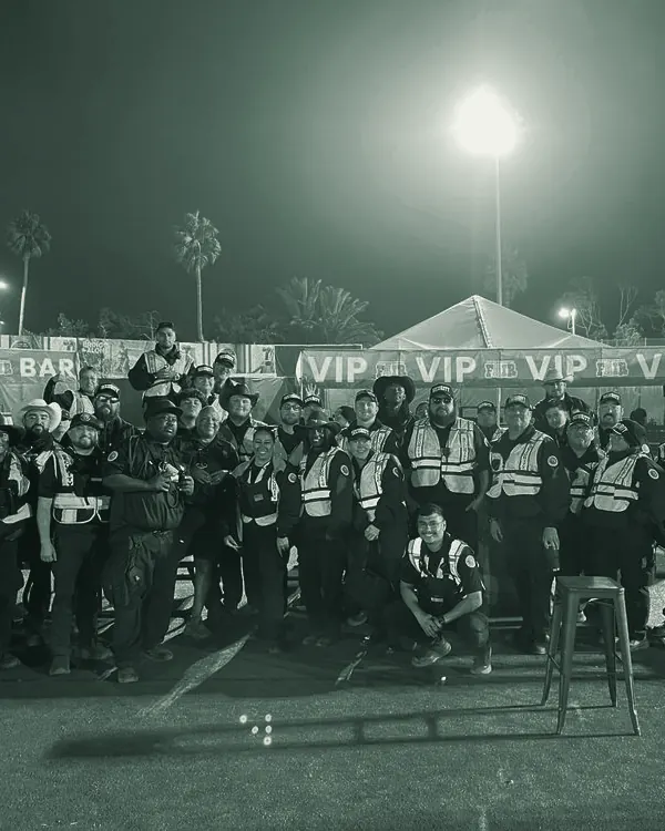 Medallion guards in uniforms and safety vests gathered for a team photo at the Ventura County Fair, 2025